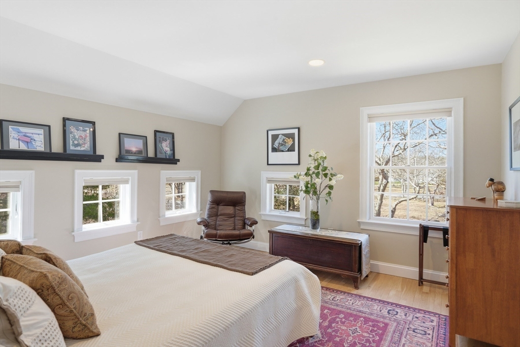 25 Bold Meadow Road Edgartown, MA 02539 - Photo 21 of 40 a bedroom with a bed a couch and a window