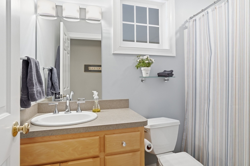 25 Bold Meadow Road Edgartown, MA 02539 - Photo 22 of 40 a bathroom with a granite countertop sink toilet and shower