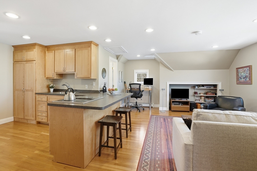 25 Bold Meadow Road Edgartown, MA 02539 - Photo 24 of 40 a kitchen with stainless steel appliances a stove a sink a oven a dining table and chairs
