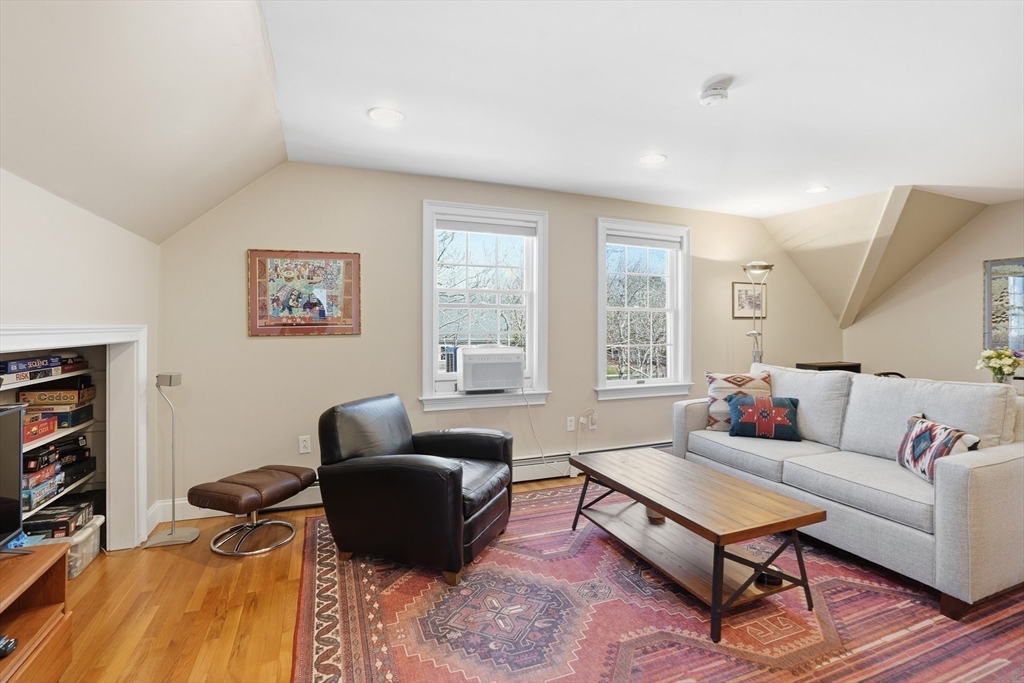 25 Bold Meadow Road Edgartown, MA 02539 - Photo 26 of 40 a living room with furniture a rug and a window