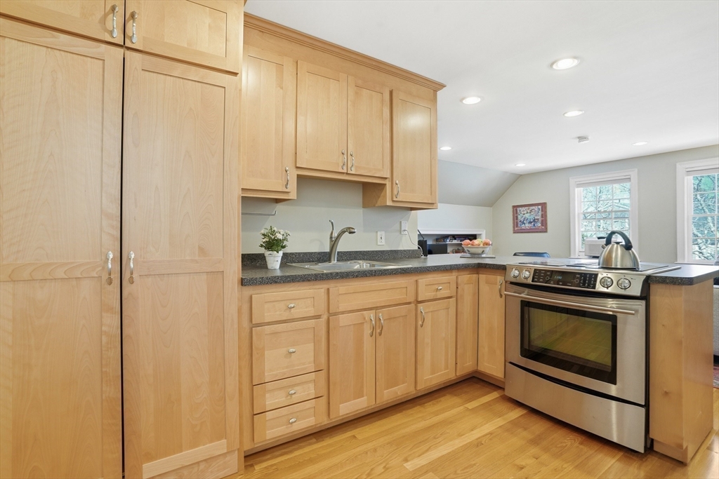 25 Bold Meadow Road Edgartown, MA 02539 - Photo 30 of 40 a kitchen with stainless steel appliances granite countertop a stove and a refrigerator