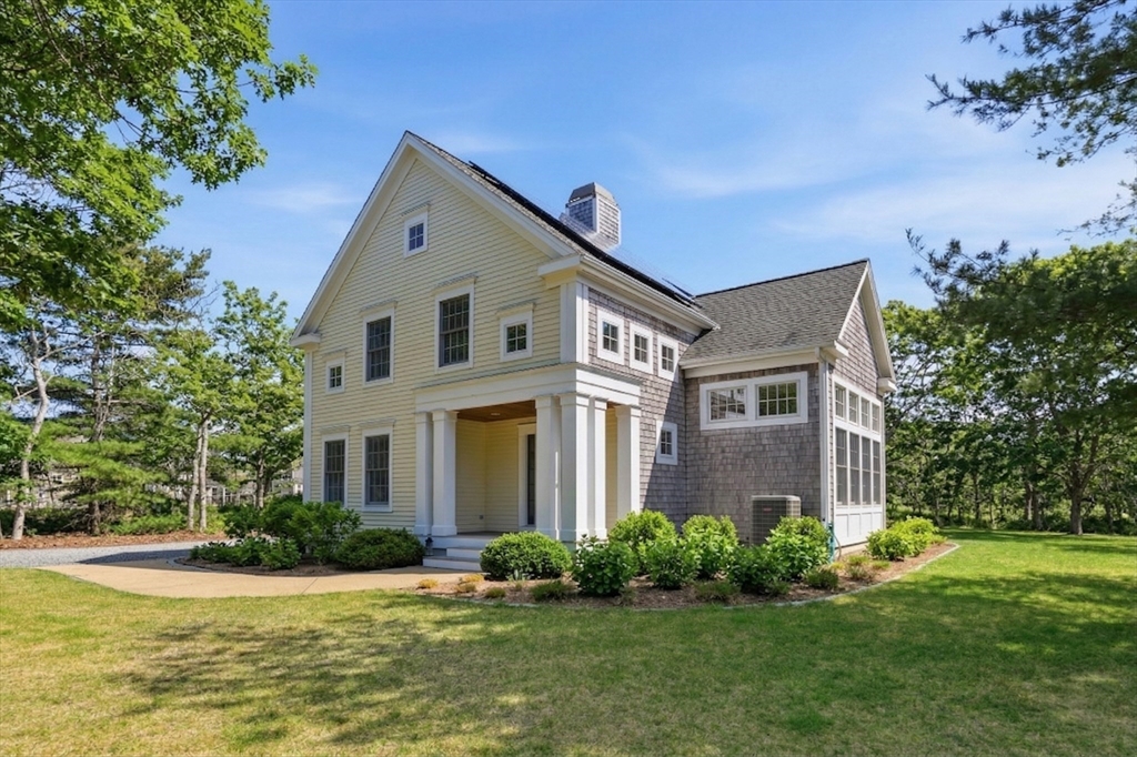 25 Bold Meadow Road Edgartown, MA 02539 - Photo 38 of 40 a front view of a house with a yard