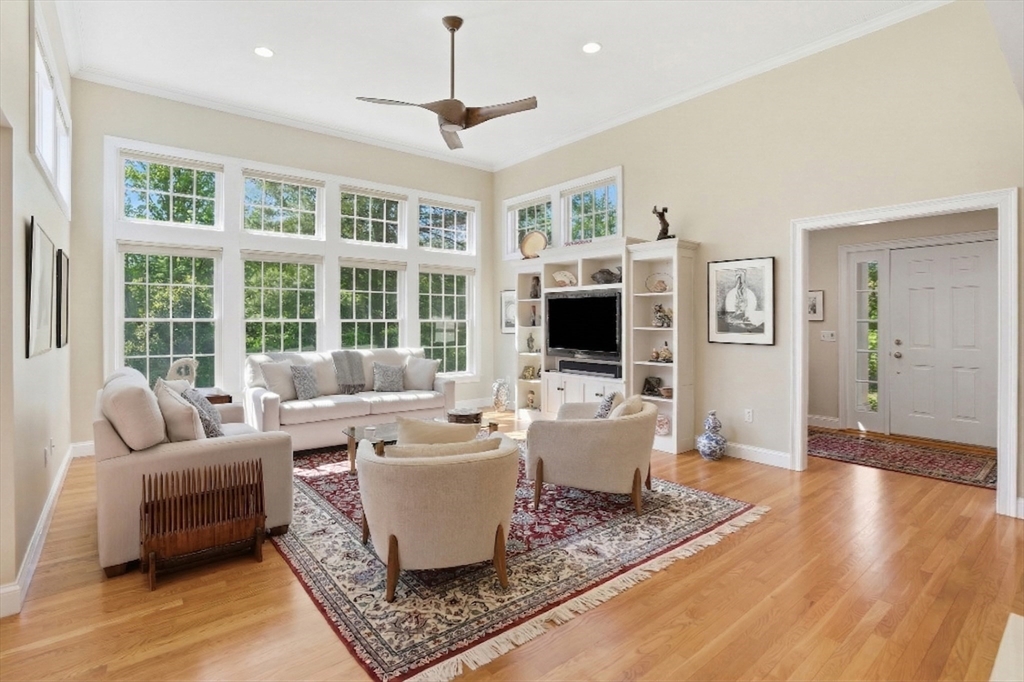 25 Bold Meadow Road Edgartown, MA 02539 - Photo 4 of 40 a living room with furniture a flat screen tv and a floor to ceiling window