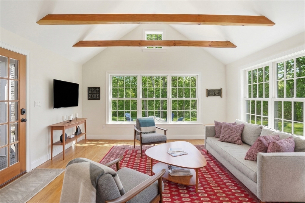 25 Bold Meadow Road Edgartown, MA 02539 - Photo 8 of 40 a living room with furniture and a flat screen tv