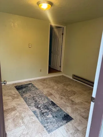 an empty room with a wooden floor