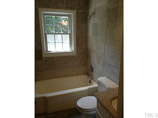 813 Welford Road Raleigh, NC 27610 - Photo 12 of 17 a bathroom with a toilet and a bathtub