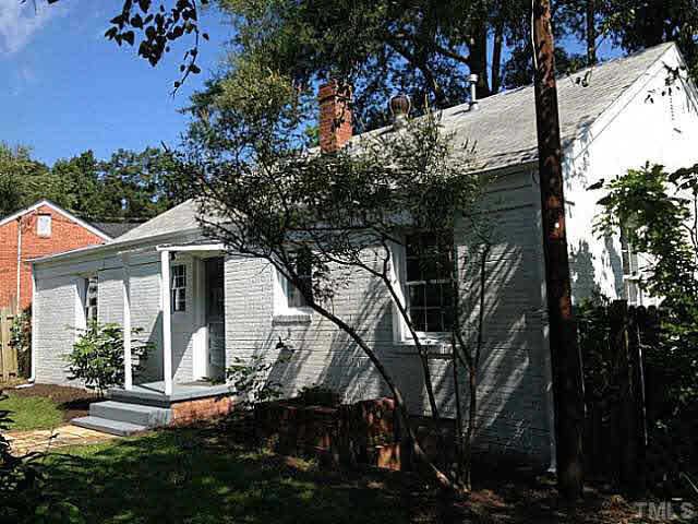 813 Welford Road Raleigh, NC 27610 - Photo 14 of 17 a front view of a house with a tree