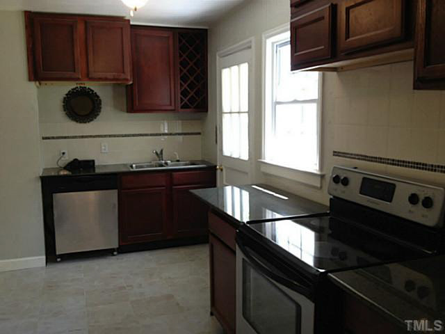 813 Welford Road Raleigh, NC 27610 - Photo 3 of 17 a kitchen with a sink appliances and cabinets