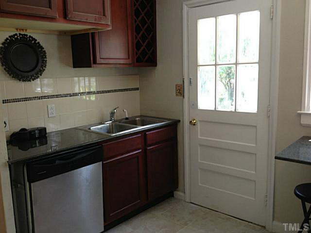 813 Welford Road Raleigh, NC 27610 - Photo 6 of 17 a kitchen with a stove and a window