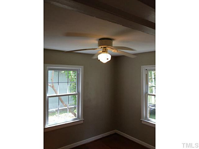 813 Welford Road Raleigh, NC 27610 - Photo 8 of 17 a view of an empty room with a window