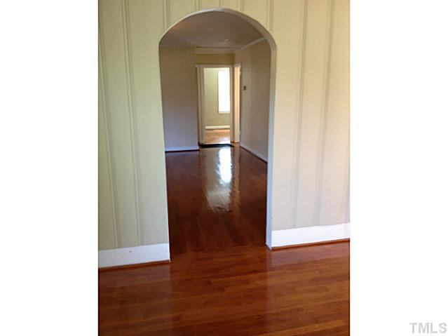 813 Welford Road Raleigh, NC 27610 - Photo 10 of 17 a view of a hallway with wooden floor