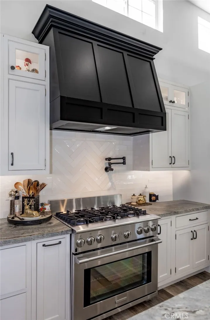 1720 Vista Del Lago, Unit 2 Fallbrook, CA 92028 - Photo 19 of 54 a kitchen with stainless steel appliances a stove and a microwave