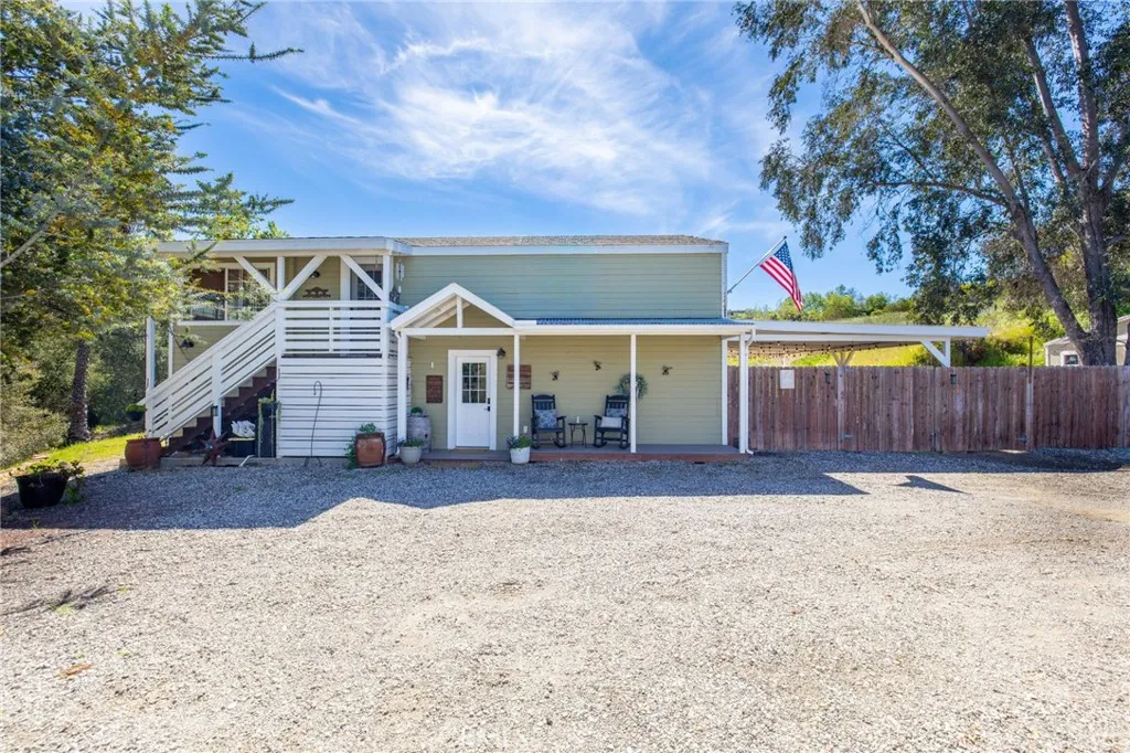 1720 Vista Del Lago, Unit 2 Fallbrook, CA 92028 - Photo 2 of 54 a view of a house with a yard and wooden fence
