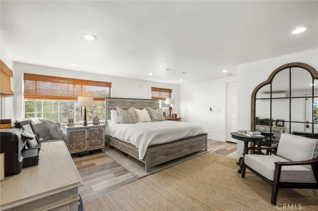 1720 Vista Del Lago, Unit 2 Fallbrook, CA 92028 - Photo 26 of 54 a spacious bedroom with a bed a couch and a large window