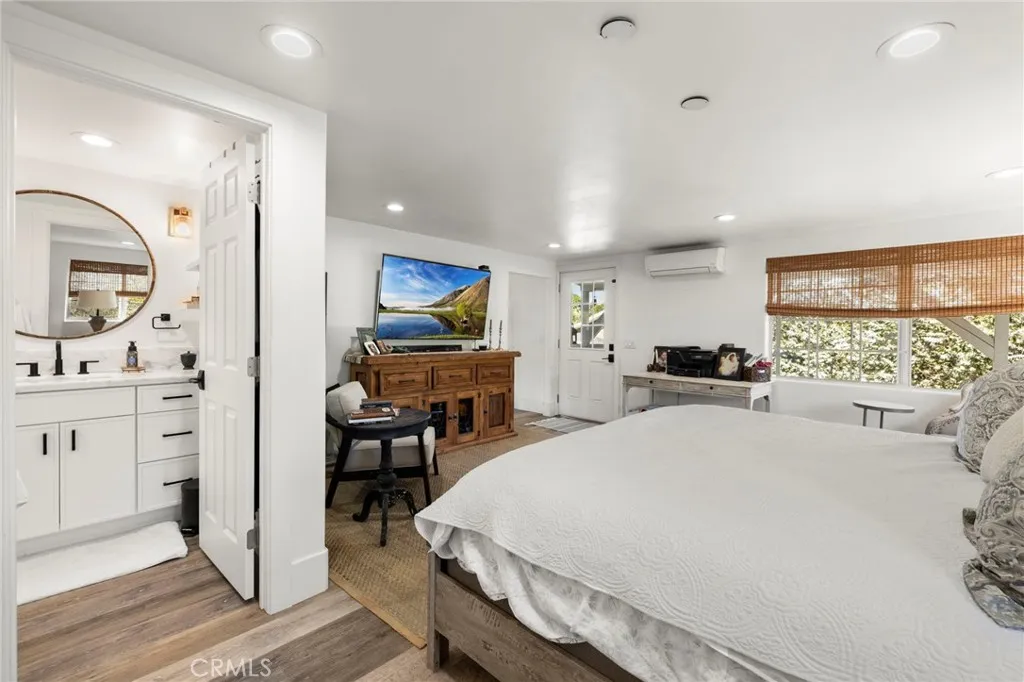 1720 Vista Del Lago, Unit 2 Fallbrook, CA 92028 - Photo 27 of 54 a large bedroom with a bed and a dresser