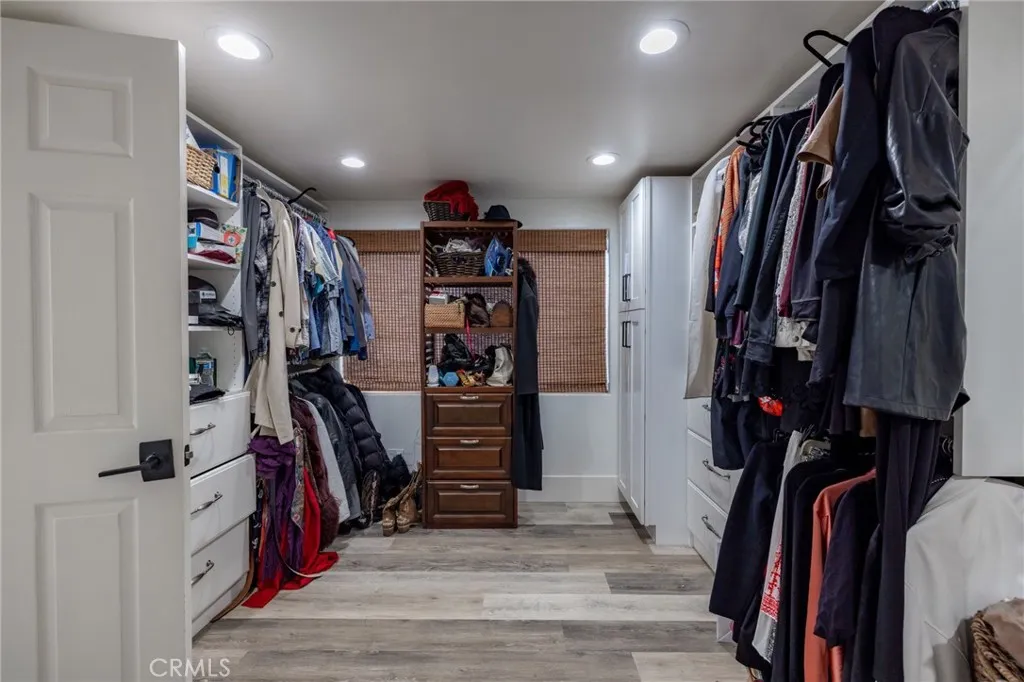 1720 Vista Del Lago, Unit 2 Fallbrook, CA 92028 - Photo 30 of 54 a view of walk in closet with clothes and shoes