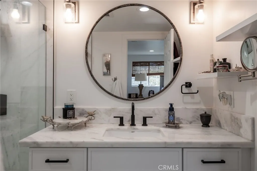 1720 Vista Del Lago, Unit 2 Fallbrook, CA 92028 - Photo 33 of 54 a bathroom with a sink and a mirror