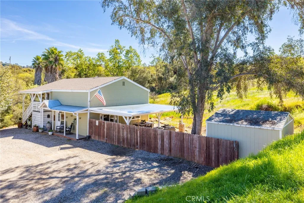 1720 Vista Del Lago, Unit 2 Fallbrook, CA 92028 - Photo 4 of 54 a view of a house with a yard and wooden fence