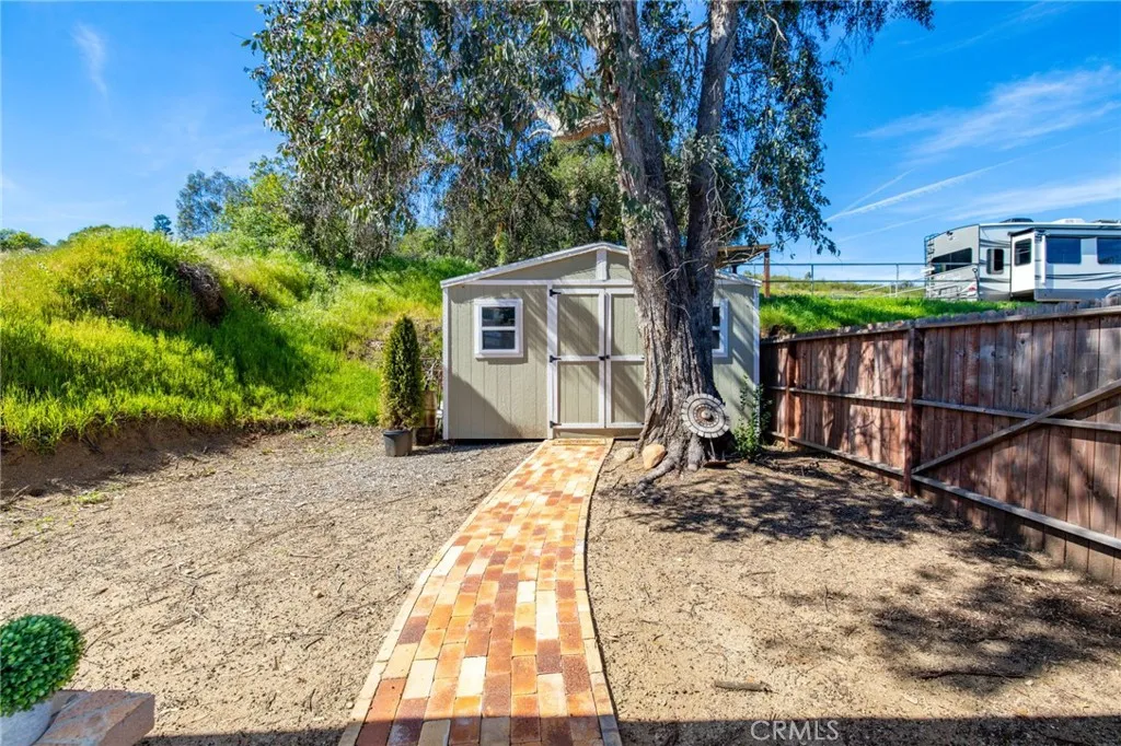 1720 Vista Del Lago, Unit 2 Fallbrook, CA 92028 - Photo 44 of 54 a house with trees in the background
