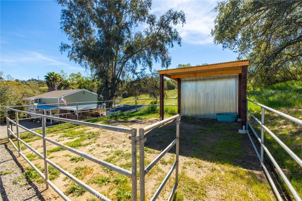 1720 Vista Del Lago, Unit 2 Fallbrook, CA 92028 - Photo 47 of 54 a view of a balcony with chairs and wooden fence