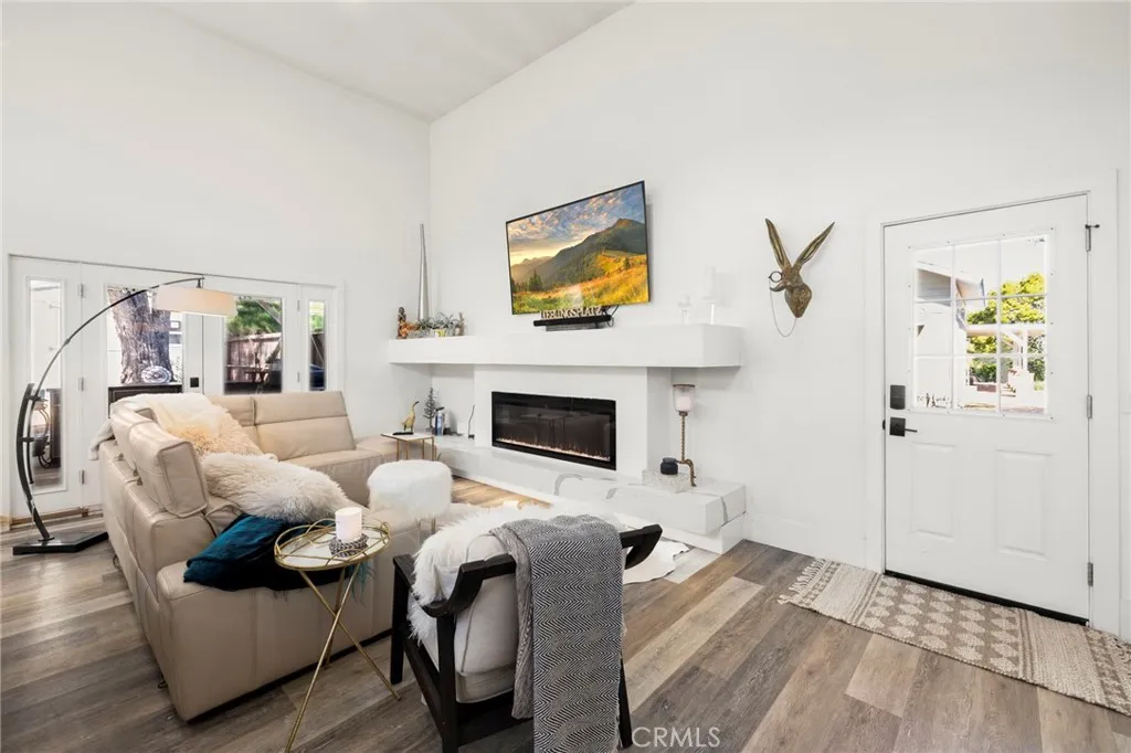 1720 Vista Del Lago, Unit 2 Fallbrook, CA 92028 - Photo 8 of 54 a living room with furniture and a fireplace