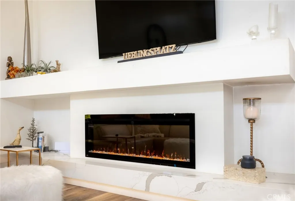 1720 Vista Del Lago, Unit 2 Fallbrook, CA 92028 - Photo 10 of 54 a fireplace with a vase of flowers on it