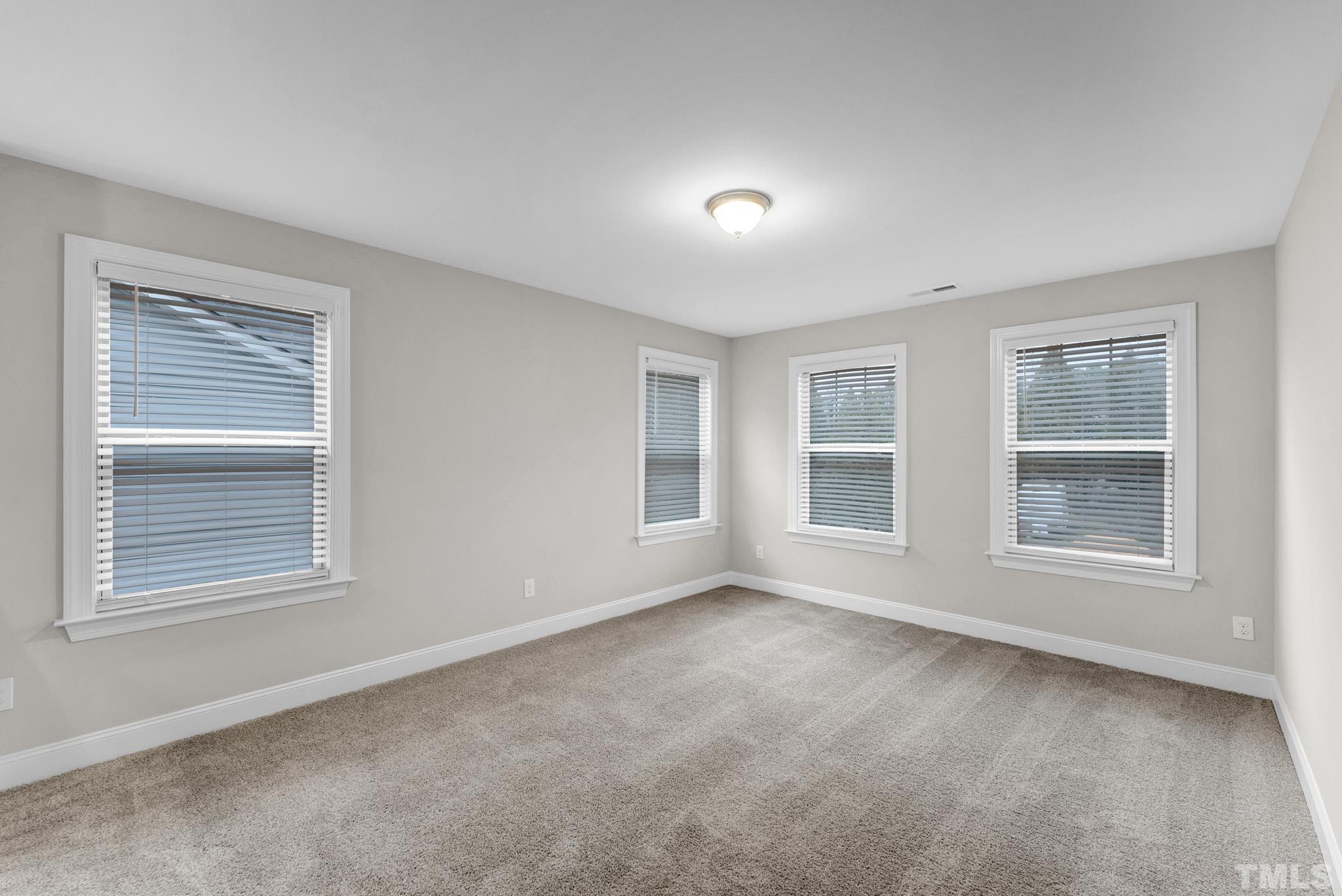 928 Barringer Drive Raleigh, NC 27606 - Photo 13 of 32 a view of an empty room with a window