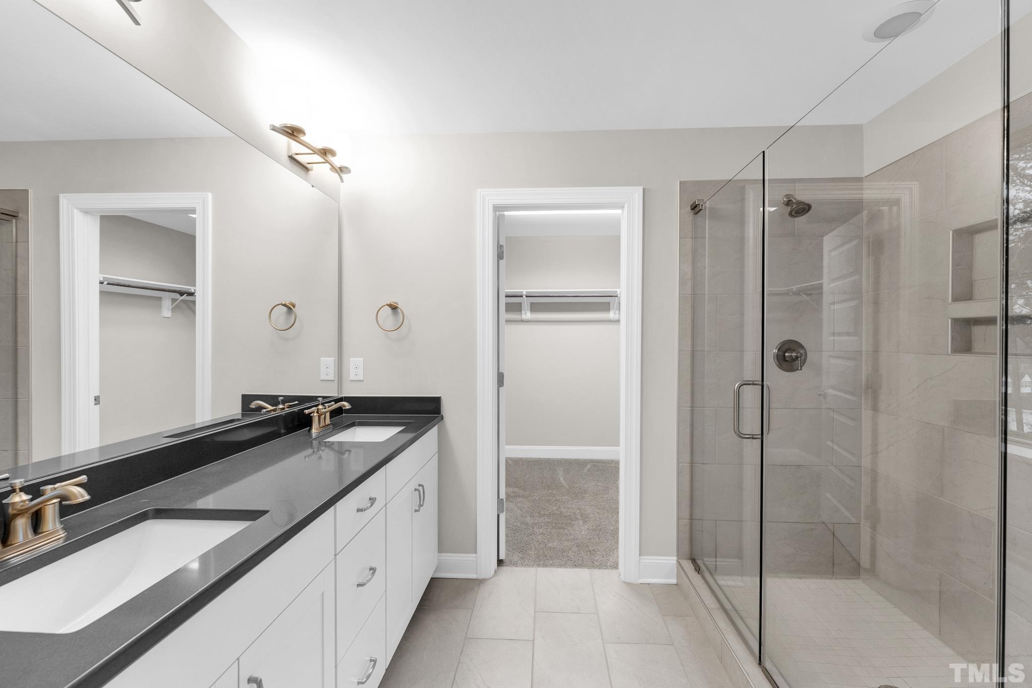 928 Barringer Drive Raleigh, NC 27606 - Photo 17 of 32 a spacious bathroom with a granite countertop sink mirror and shower