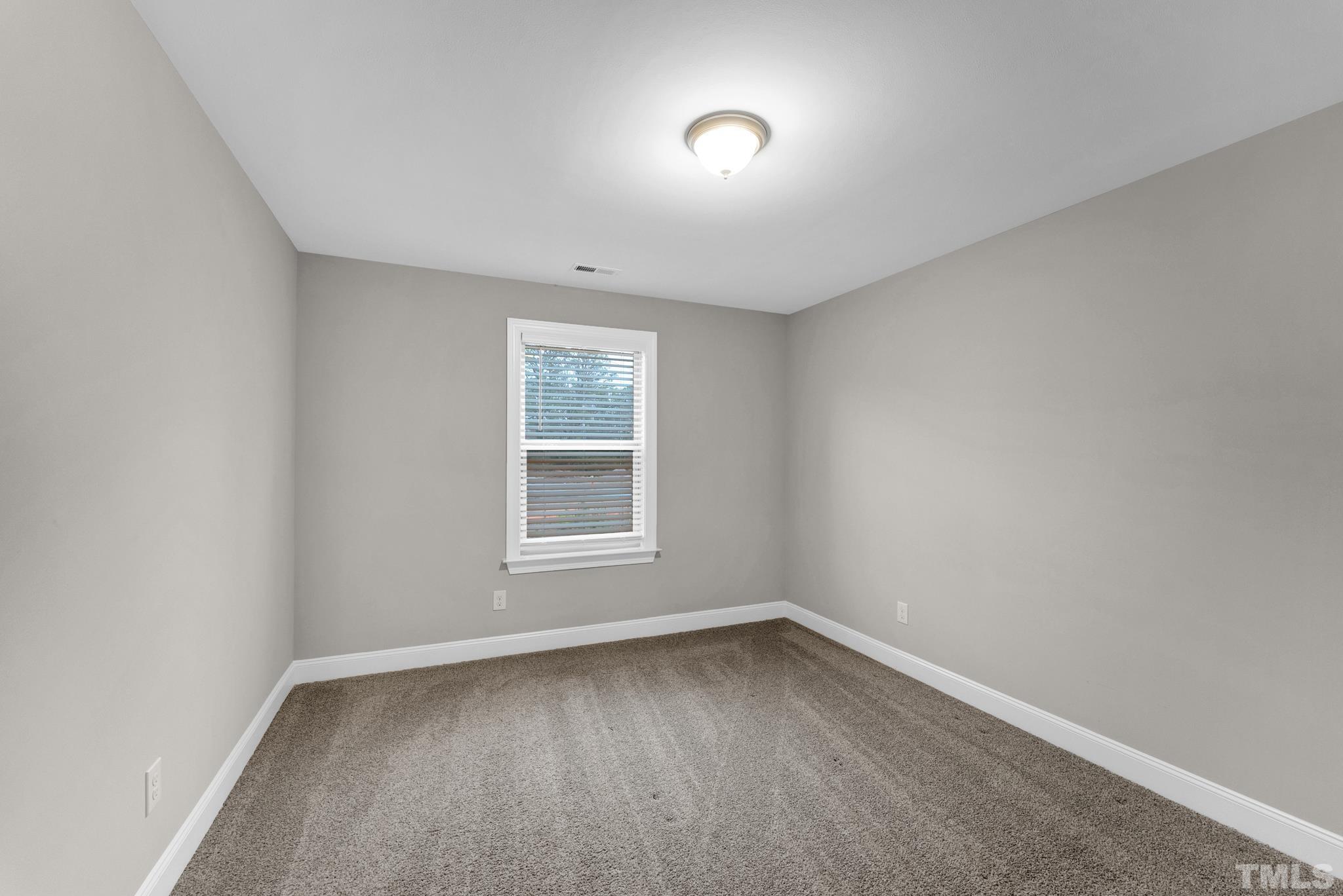 928 Barringer Drive Raleigh, NC 27606 - Photo 20 of 32 an empty room with a window