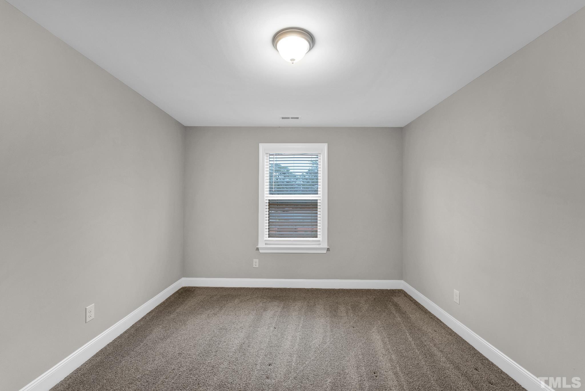 928 Barringer Drive Raleigh, NC 27606 - Photo 21 of 32 a view of a room that has a window