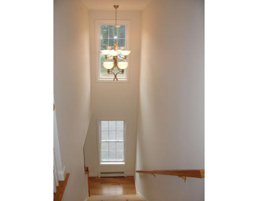 22 Scribner Road, Unit 81 Fremont, NH 03044 - Photo 5 of 10 a view of front door with wooden floor