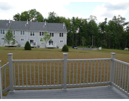 22 Scribner Road, Unit 81 Fremont, NH 03044 - Photo 10 of 10 a view of a house and a yard
