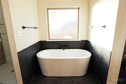 a white toilet sitting in a bathroom