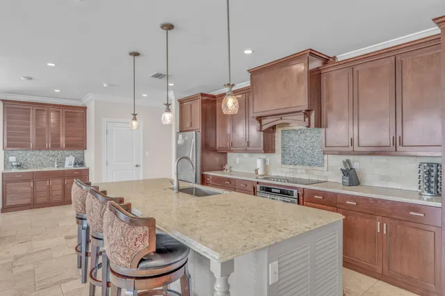 a kitchen with granite countertop cabinets and a dining table