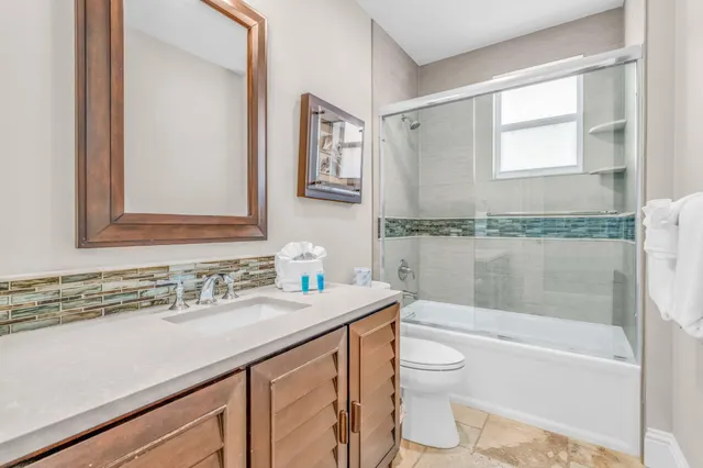 a bathroom with a tub and a shower