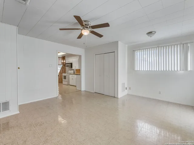 a view of an empty room with a window