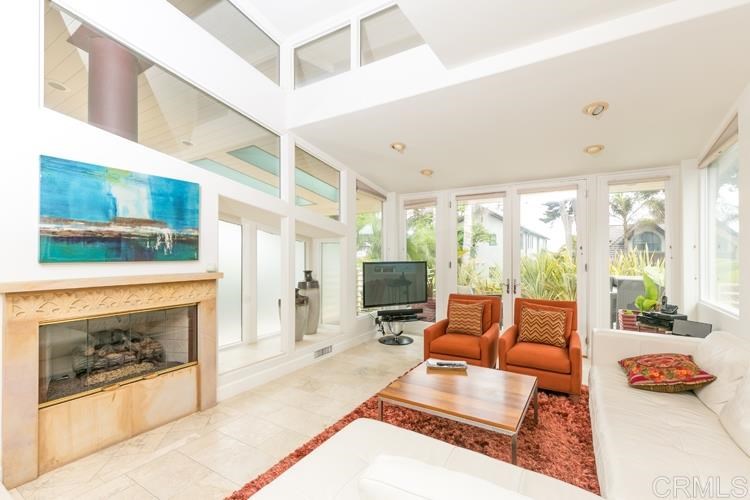 1407 Ocean Avenue Del Mar, CA 92014 - Photo 4 of 9 a living room with furniture and a fireplace
