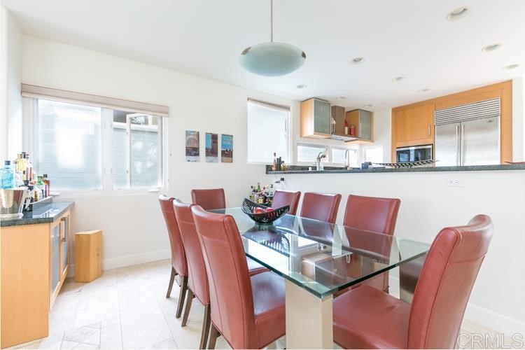 1407 Ocean Avenue Del Mar, CA 92014 - Photo 5 of 9 a dining room with furniture and window