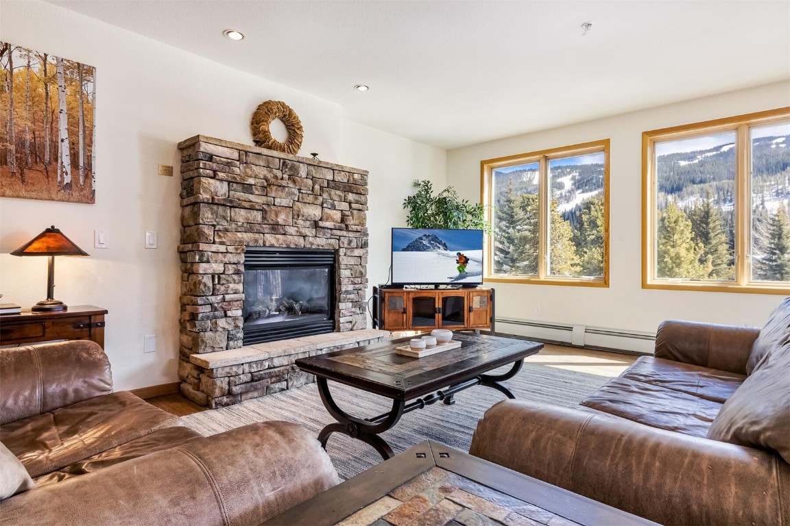 23110 Highway 6, Unit 5015 Keystone, CO 80435 - Photo 1 of 32 a living room with furniture fireplace and window
