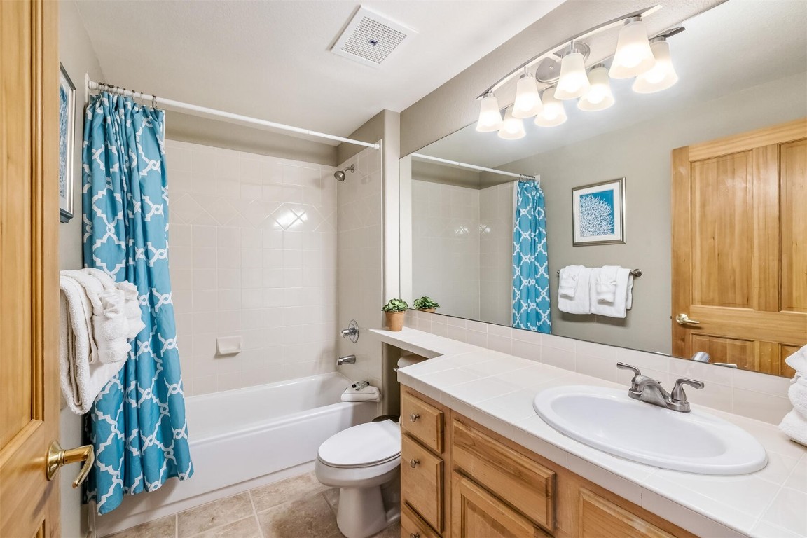 23110 Highway 6, Unit 5015 Keystone, CO 80435 - Photo 20 of 32 a bathroom with a sink toilet and shower