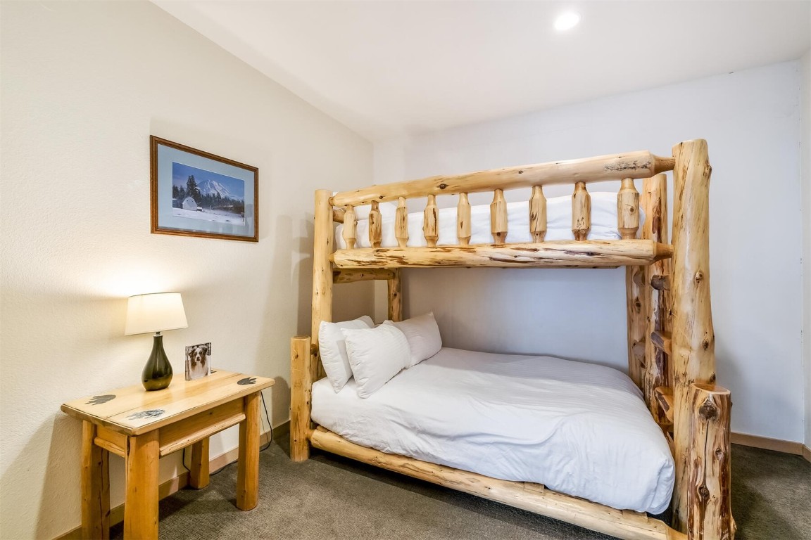 23110 Highway 6, Unit 5015 Keystone, CO 80435 - Photo 21 of 32 a bedroom with a bed and table
