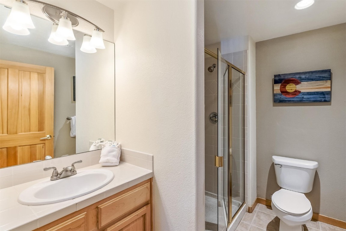 23110 Highway 6, Unit 5015 Keystone, CO 80435 - Photo 22 of 32 a bathroom with a toilet sink and mirror
