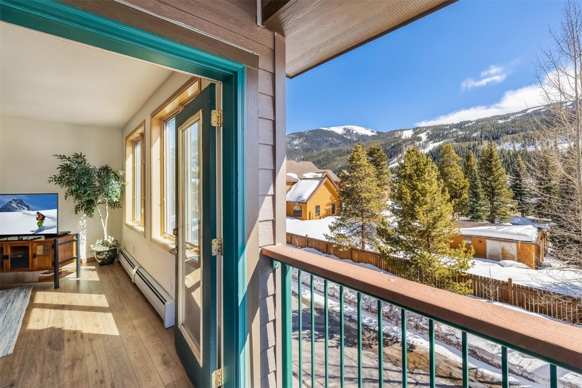 23110 Highway 6, Unit 5015 Keystone, CO 80435 - Photo 24 of 32 a view of a balcony with furniture and a floor to ceiling window