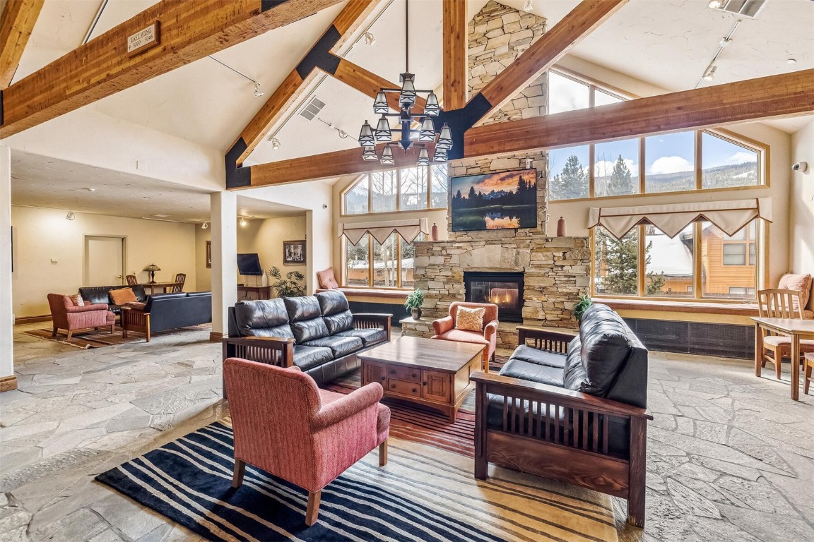 23110 Highway 6, Unit 5015 Keystone, CO 80435 - Photo 26 of 32 a living room with fireplace furniture and a large window