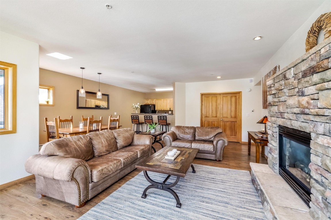 23110 Highway 6, Unit 5015 Keystone, CO 80435 - Photo 5 of 32 a living room with furniture and a fireplace