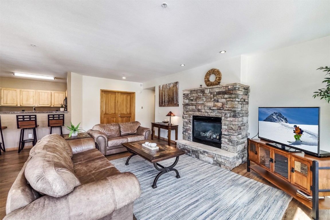 23110 Highway 6, Unit 5015 Keystone, CO 80435 - Photo 6 of 32 a living room with furniture and a fireplace