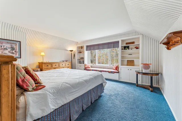 a bathroom with a toilet and a shower curtain