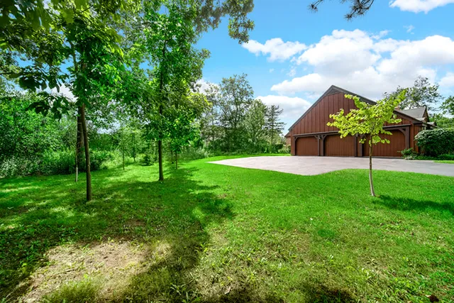 a view of a house with a backyard