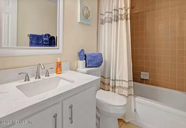 a view of a hallway with living room and entryway