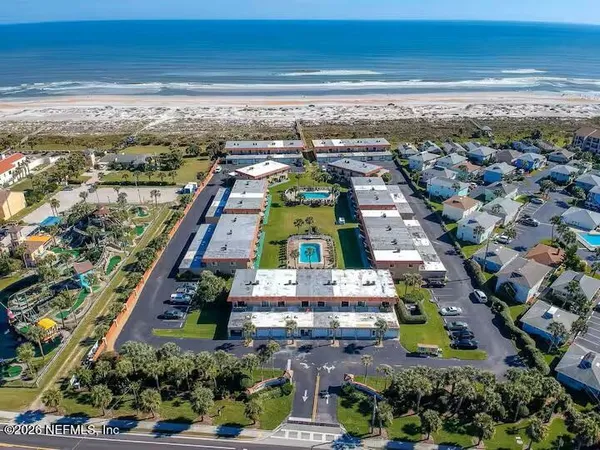 a view of a swimming pool with outdoor seating